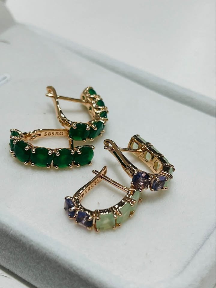 A pair of 585RG rolled gold huggie hoops with multicolored gemstones, a perfect everyday accessory.