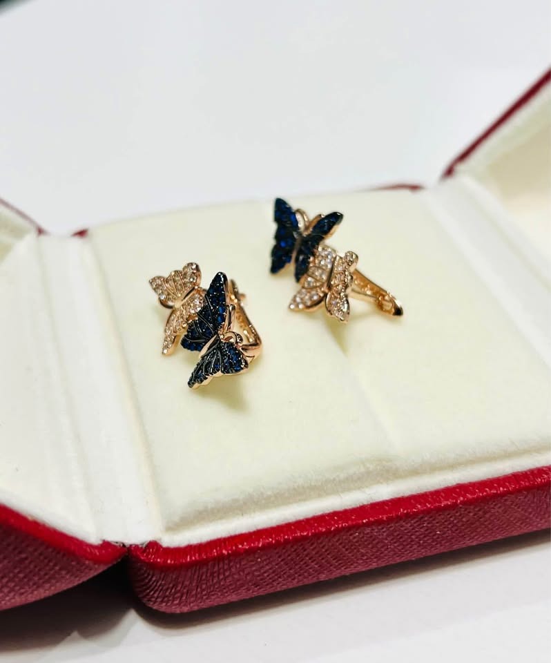 Two-tone crystal butterfly earrings in 14k rolled gold, a beautiful and delicate accessory for any look.