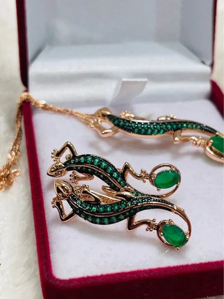 Matching rolled gold 585RG salamander earrings and pendant with green emeralds, in a velvet box.