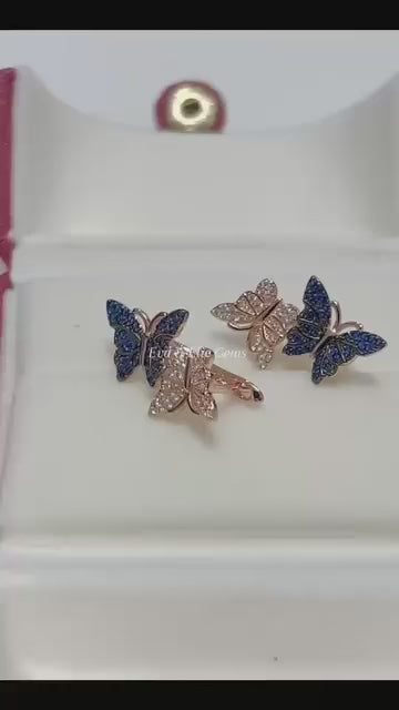 Stunning butterfly earrings with blue and pink stones in a 14k rolled gold finish.