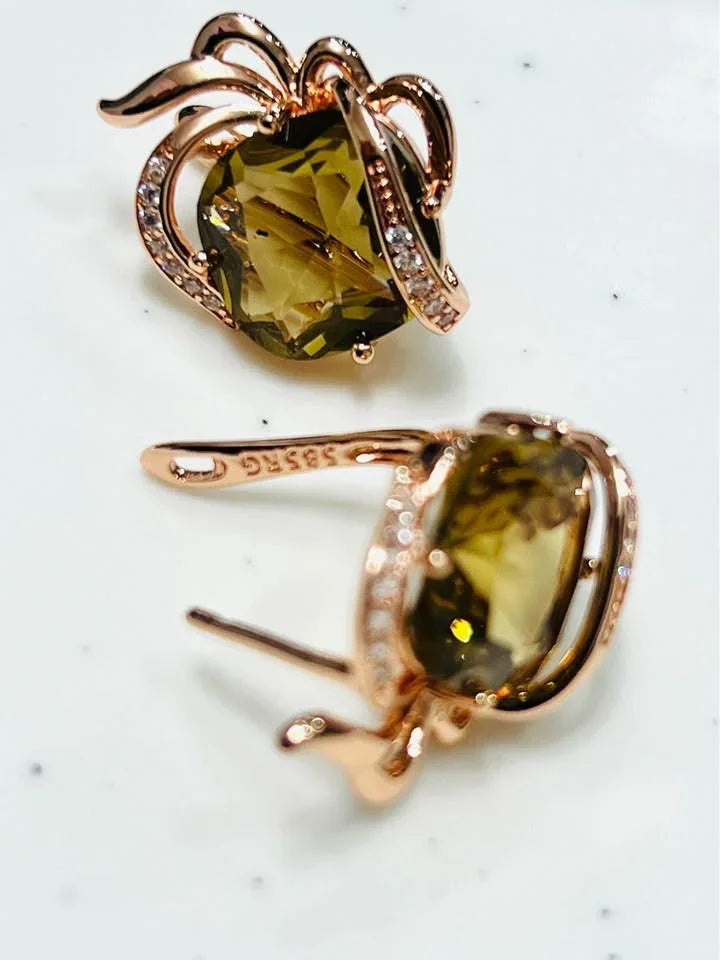 A view of the front and back of the 14k gold-filled earrings, showing the citrine gemstone and the post.