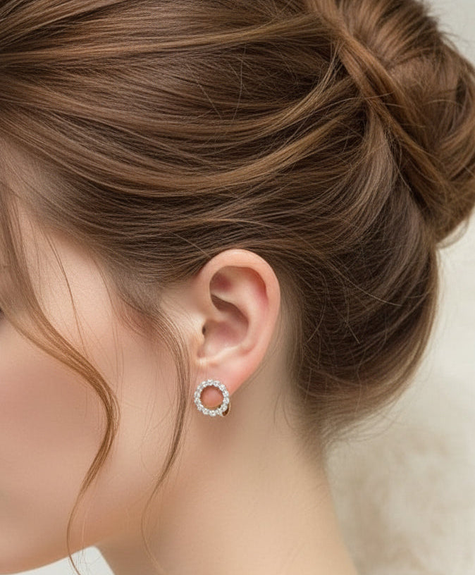  14K 585RG stamped rolled gold white round earring displayed on a black mannequin ear.