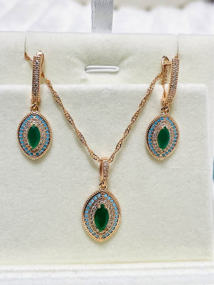 A 14K RG585 stamped jewelry set, including a pendant necklace and earrings with emerald and turquoise accents.