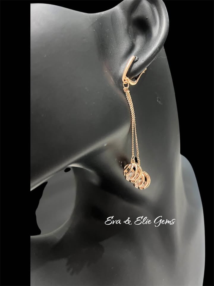 Stylish 14k rolled gold 585RG stamped earrings with natural zircons, displayed on a black mannequin.