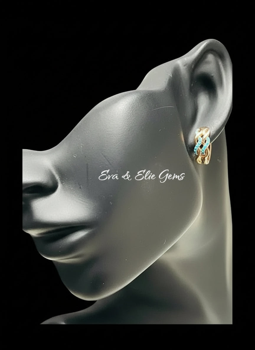  A model wearing a 14k 585RG rose gold huggie hoop earring with turquoise gemstones.