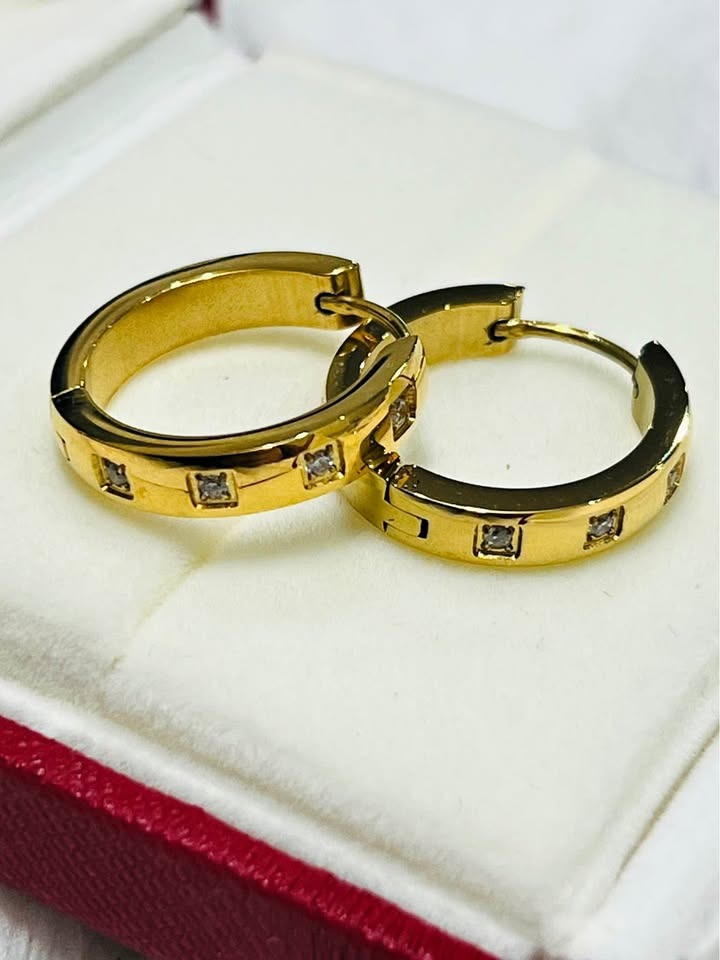 A gift-ready pair of 18K gold vermeil waterproof Julia hoop earrings displayed in a box.