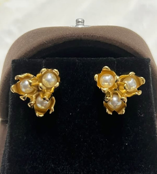 Pair of 18k gold filled tulip design pearl earrings displayed in a brown velvet jewelry box, front view.