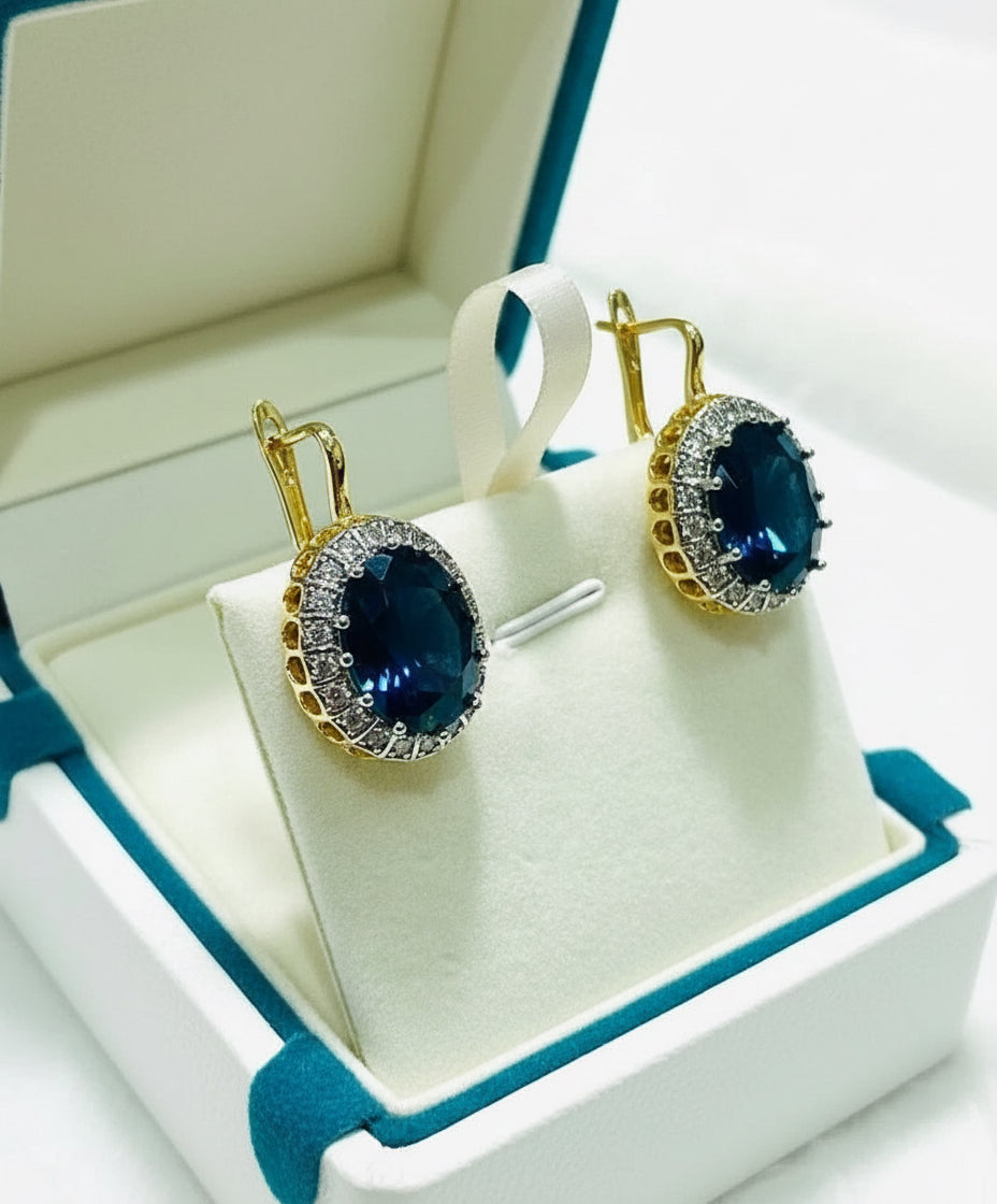 18k gold vermeil oval blue sapphire earrings with a sparkling cubic zirconia halo.