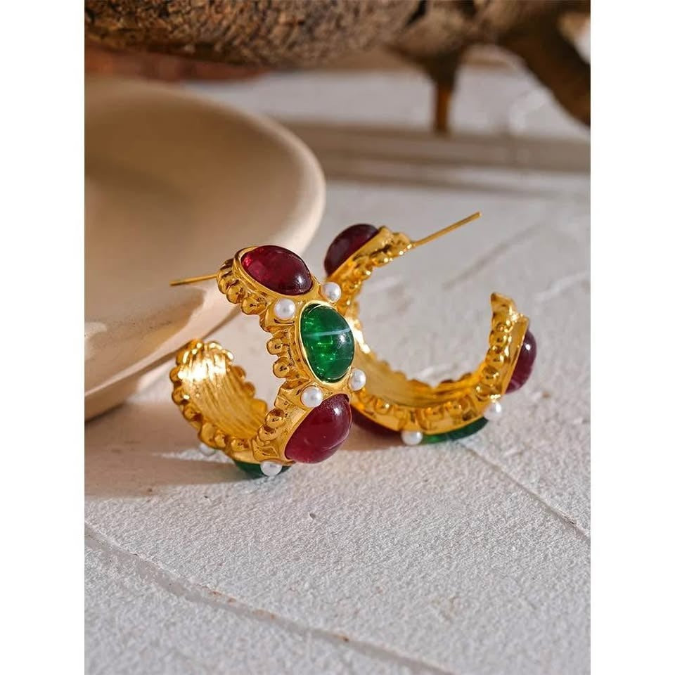  Studio shot of 18k gold vermeil East West earrings, showcasing their colorful gemstones and intricate pearl details.