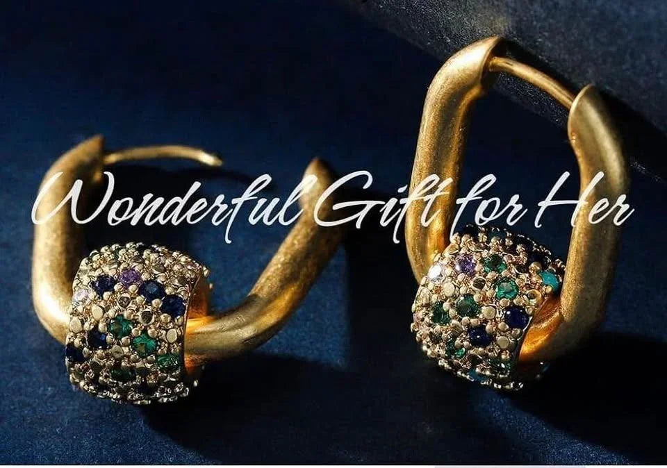 Close-up of beautiful 18k gold vermeil earrings with colorful rhinestone rolling ball pendants, a wonderful gift idea.