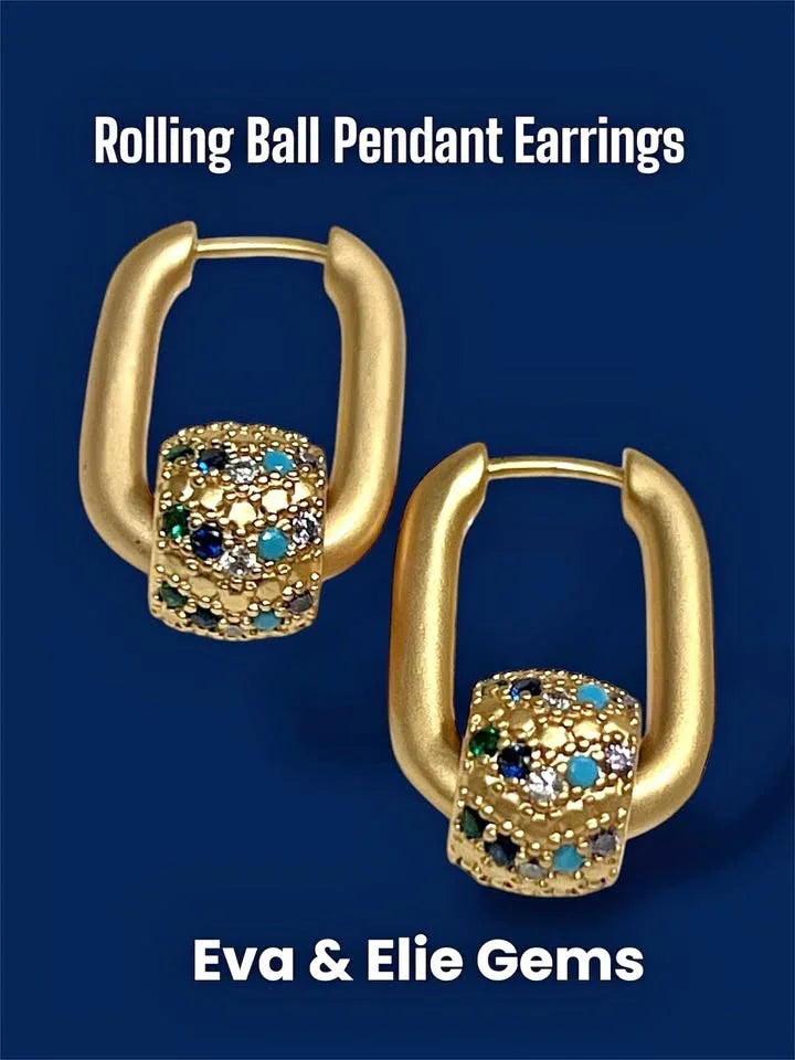 A pair of 18k gold vermeil earrings with unique rolling ball pendants, featuring sparkling rhinestones.