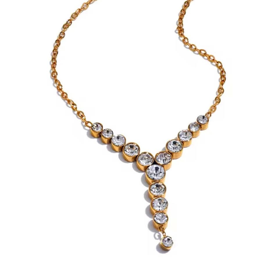 Stunning 18k gold-filled necklace featuring a Y-shaped design with multiple brilliant round stones.