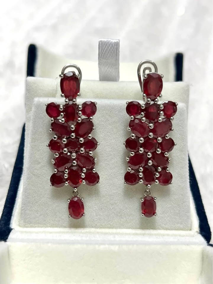 Pair of 20 CT genuine certified ruby earrings, beautifully displayed in a jewelry box.