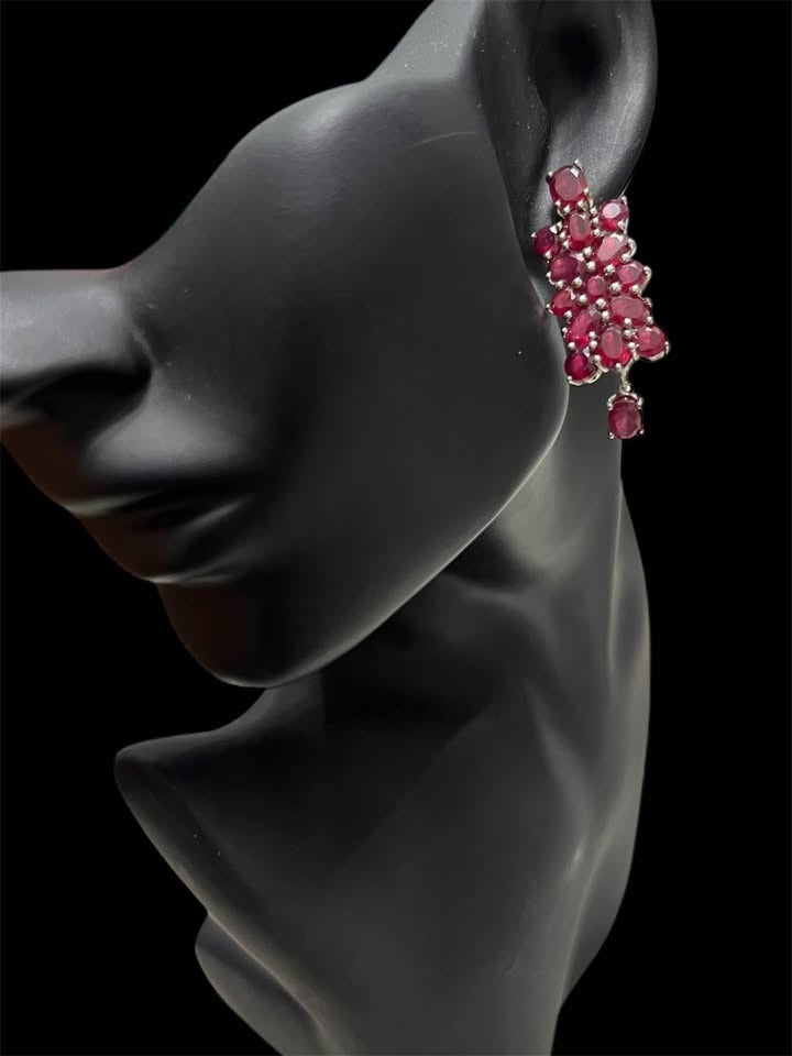  Model wearing 20 CT genuine certified ruby drop earrings in sterling silver, elegant and bold.