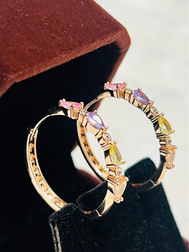 Pair of 585RG rose gold stacked tourmaline hoop earrings with sparkling accents, resting in an open jewelry box.