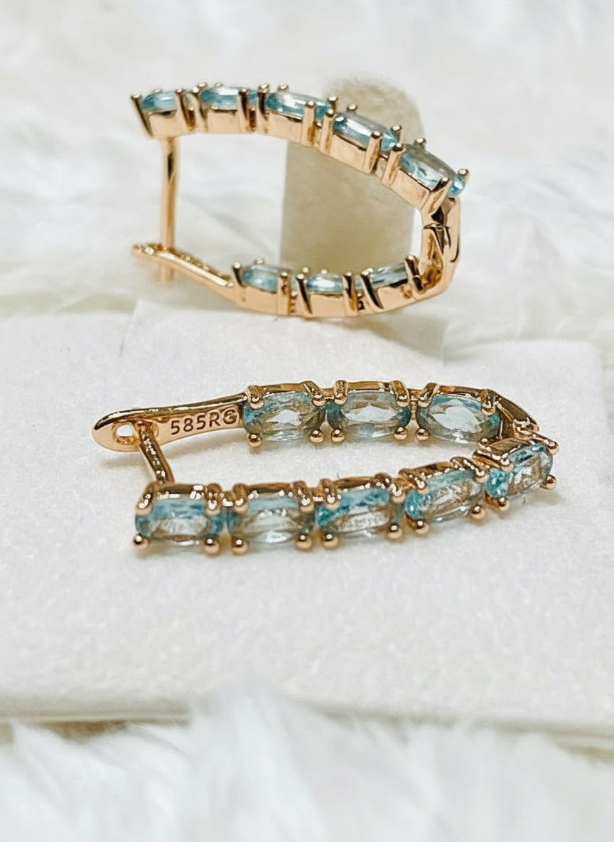 Elegant 14k 585RG rose gold aquamarine inside-out hoop earrings, showcasing the side profile