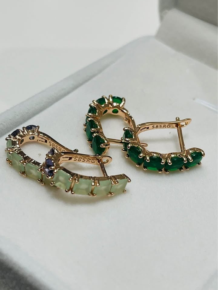  585RG rolled gold huggie hoops featuring vibrant green and light-colored gemstones.