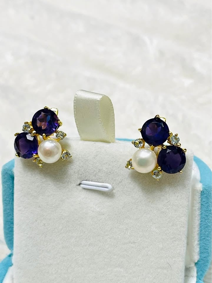 Natural amethyst and freshwater pearl cluster earrings with gold accents, displayed in a light blue box.