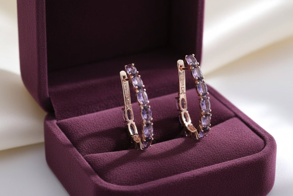 Elegant 14K rose gold and amethyst hoop earrings on a clean white background, showcasing design.