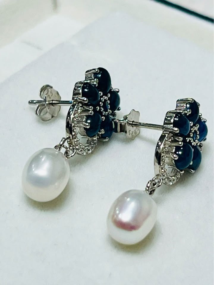 Back view of natural blue sapphire and pearl dangle earrings, highlighting craftsmanship.