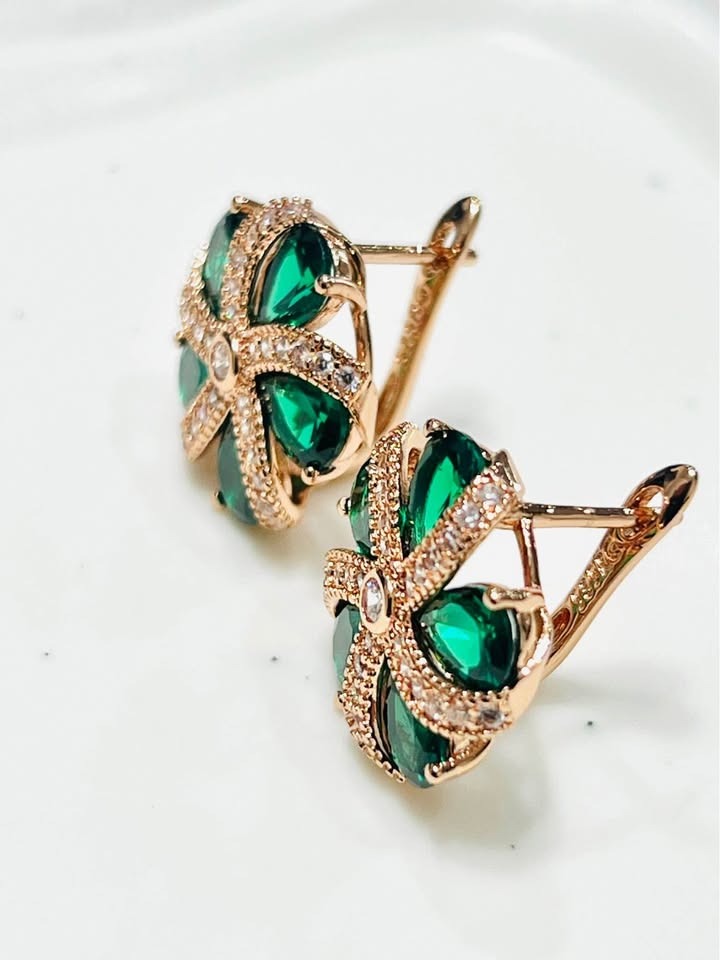 Close-up showing the intricate back details of 14K rose gold green topaz floral earrings.