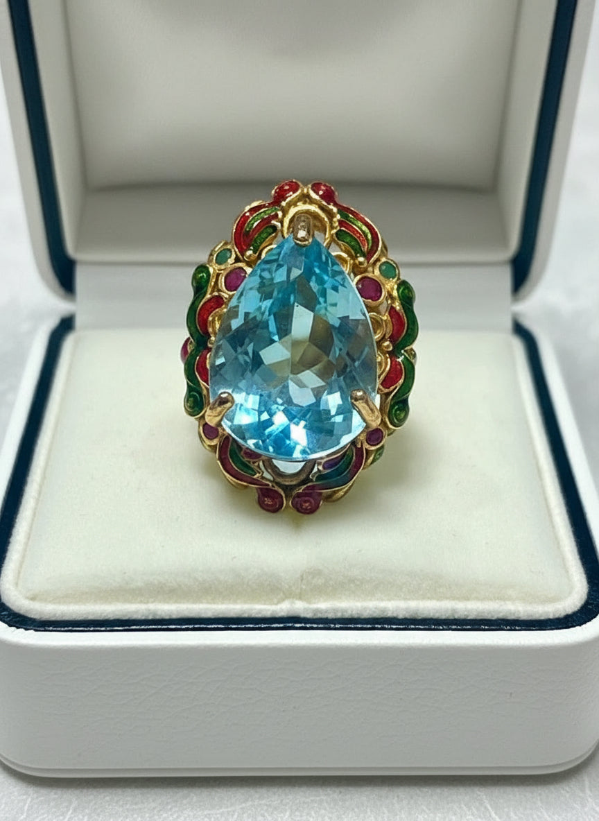 Frontal view of a stunning 22ct natural blue topaz antique royal handmade ring in a display box.