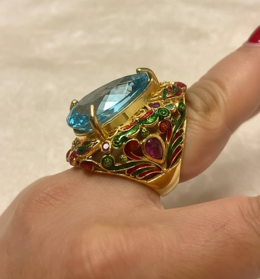  A close-up of a 22ct natural blue topaz antique royal handmade ring beautifully worn on a hand.