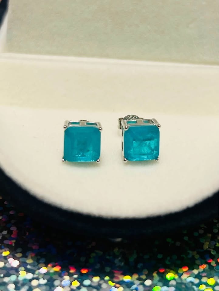 Pair of dainty genuine blue topaz square stud earrings in sterling silver, ready for gifting in a sleek black box.