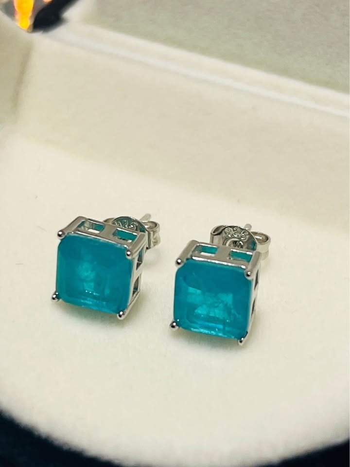  Dainty genuine blue topaz square stud earrings in sterling silver, displayed clearly on a clean white background.
