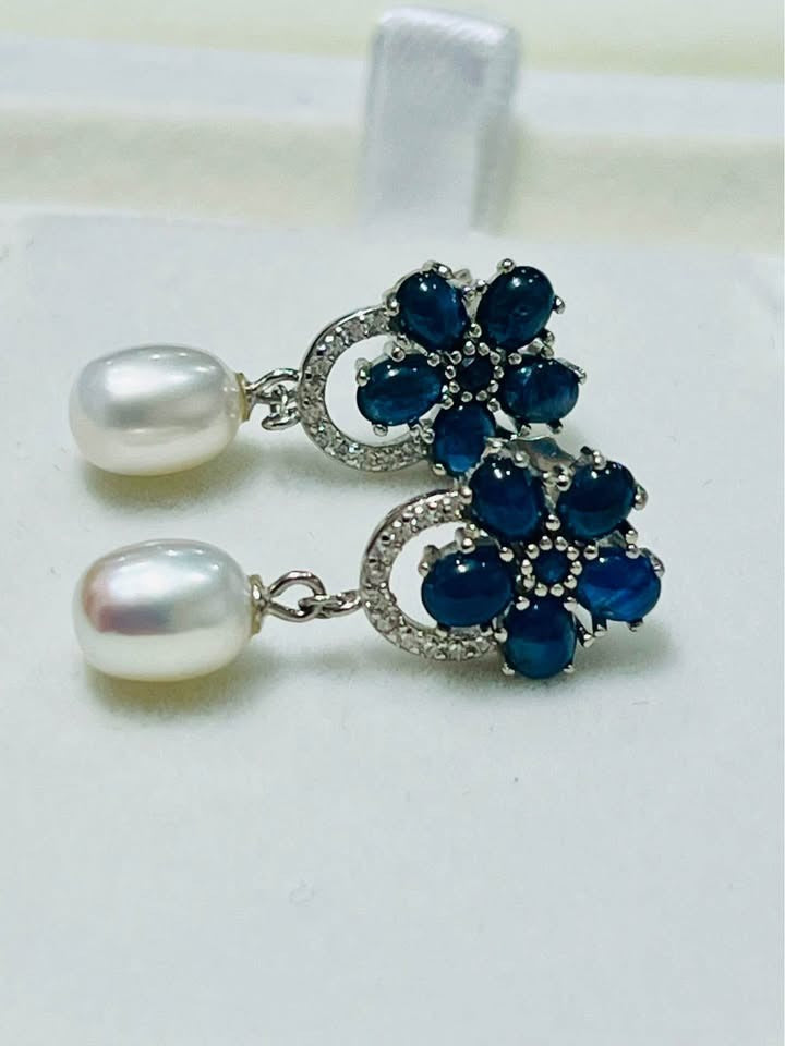  Exquisite blue sapphire and dangle pearl earrings, showcasing natural gems.