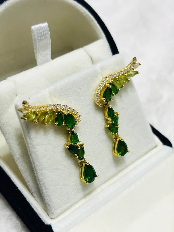 Real chrome diopside and peridot angel wing ear climber earrings, gold-tone setting, unique side view.