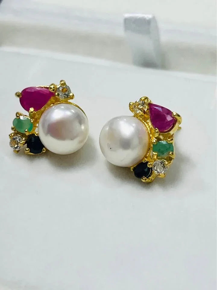 Designer South Sea pearl earrings with a vibrant cluster of natural Colombian emeralds, rubies, sapphires, and topaz.