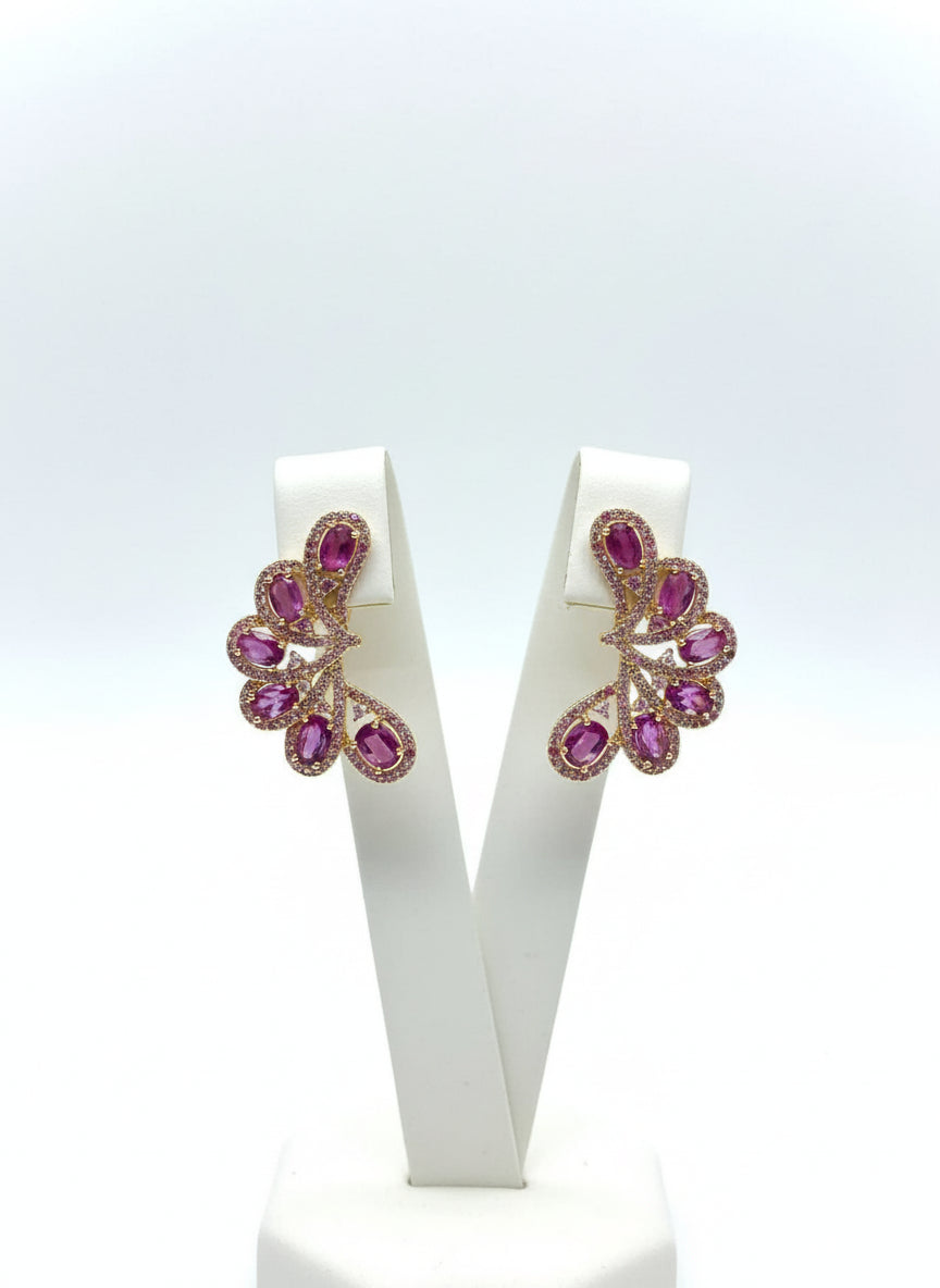 Detailed view of genuine 925 sterling silver ear climbers. The design features beautiful pink rubies and pink sapphires.
