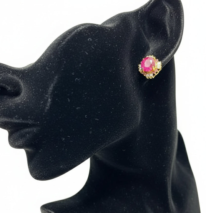 Detailed view of a beautiful floral cluster ring. It features a central tanzanite, with multi-colored stones.