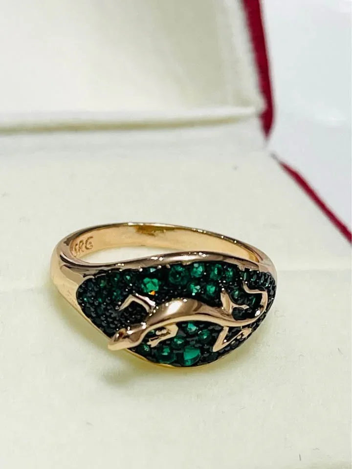 Elegant 585RG stamped rolled gold salamander ring, adorned with vibrant green gemstones.