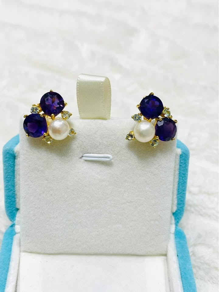 Elegant sterling silver earrings with natural amethyst and pearl gemstones, perfect for any occasion.
