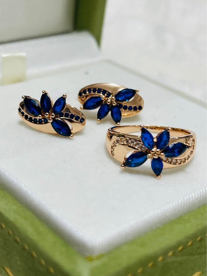  Elegant 14k 585RG rose gold jewelry set, including a ring and earrings with vibrant sapphire stones.