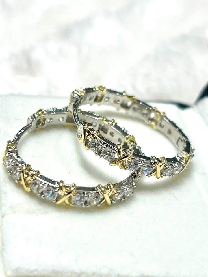 Elegant XOXO design hoop earrings, gold plated silver, displayed on white.
