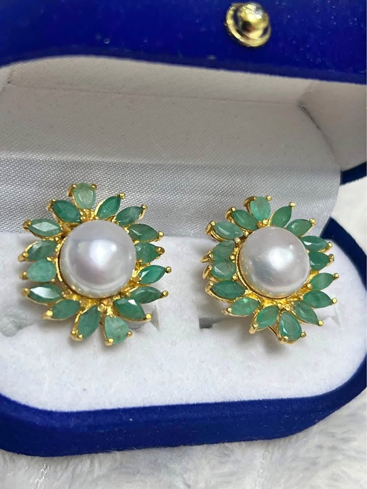 Elegant natural South Sea pearl and emerald halo earrings in sterling silver, displayed in a blue gift box.