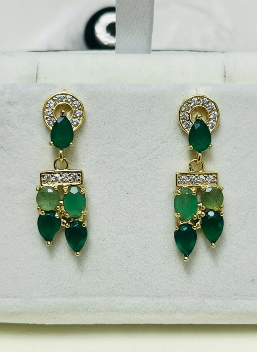  Beautiful pair of natural Colombian emerald gemstone dangle earrings, showcasing vibrant green hues.