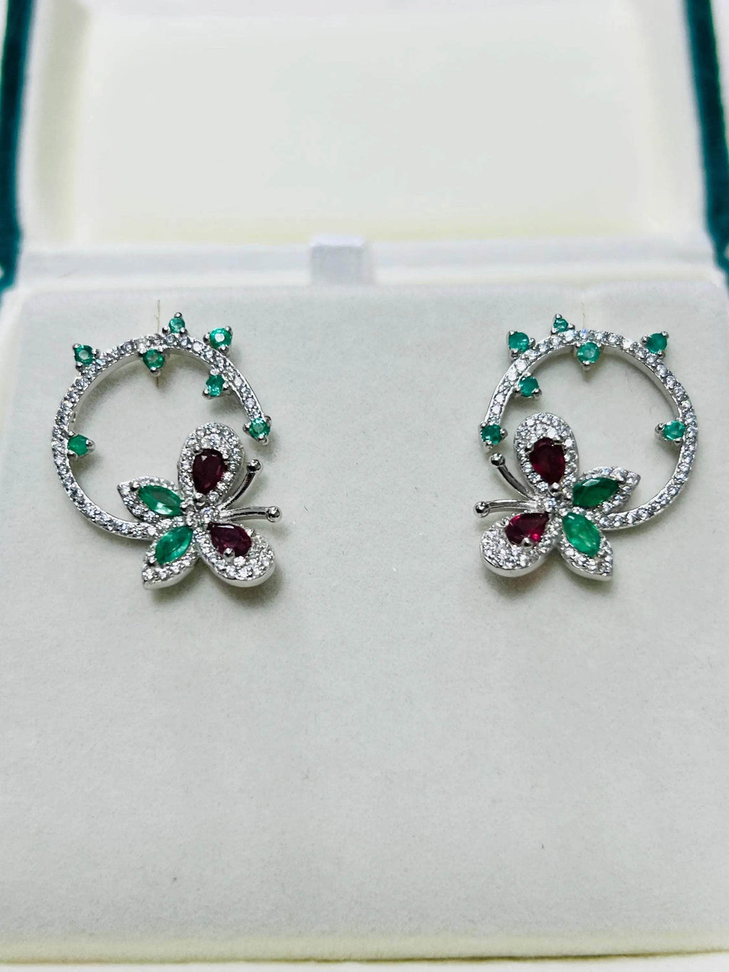  Stunning emerald and ruby butterfly and flower stud earrings, perfect for adding a touch of nature-inspired elegance.