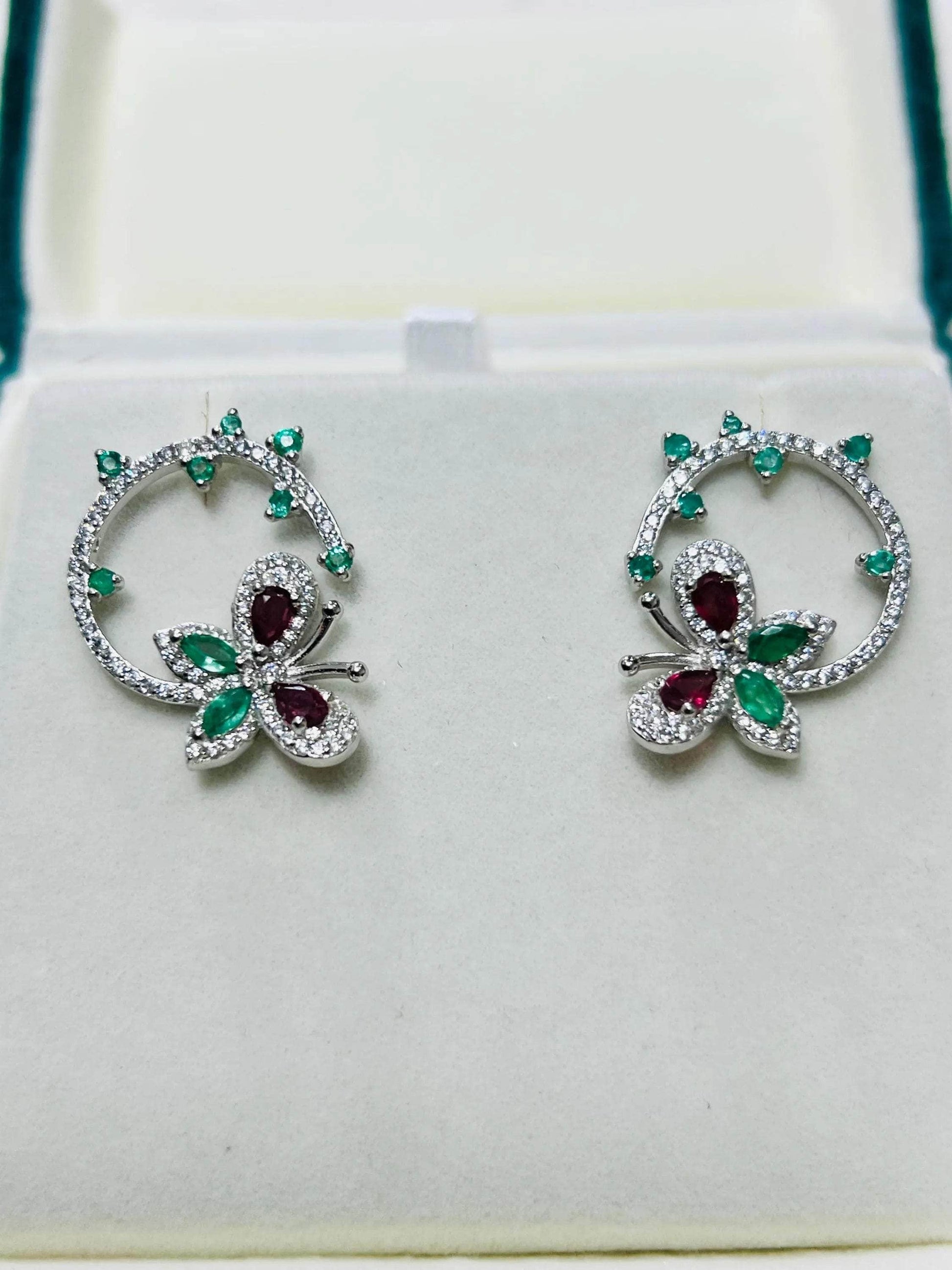  Stunning emerald and ruby butterfly and flower stud earrings, perfect for adding a touch of nature-inspired elegance.
