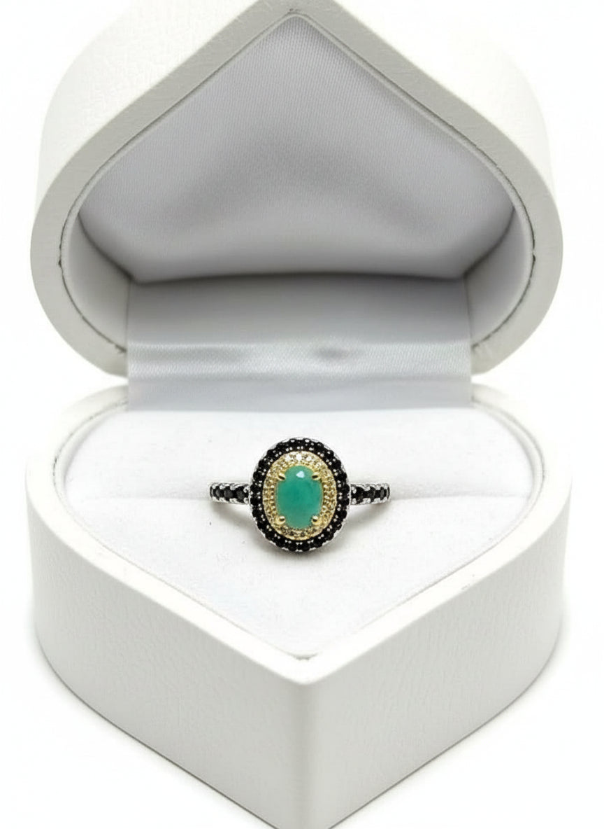 Genuine emerald and spinel ring, two-toned gold and silver, presented in a heart-shaped box.