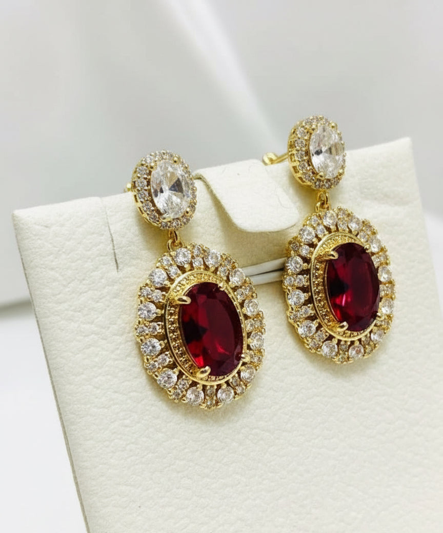 Side view of fancy gold-plated earrings with a layered leaf design, showing the lightweight and intricate structure.