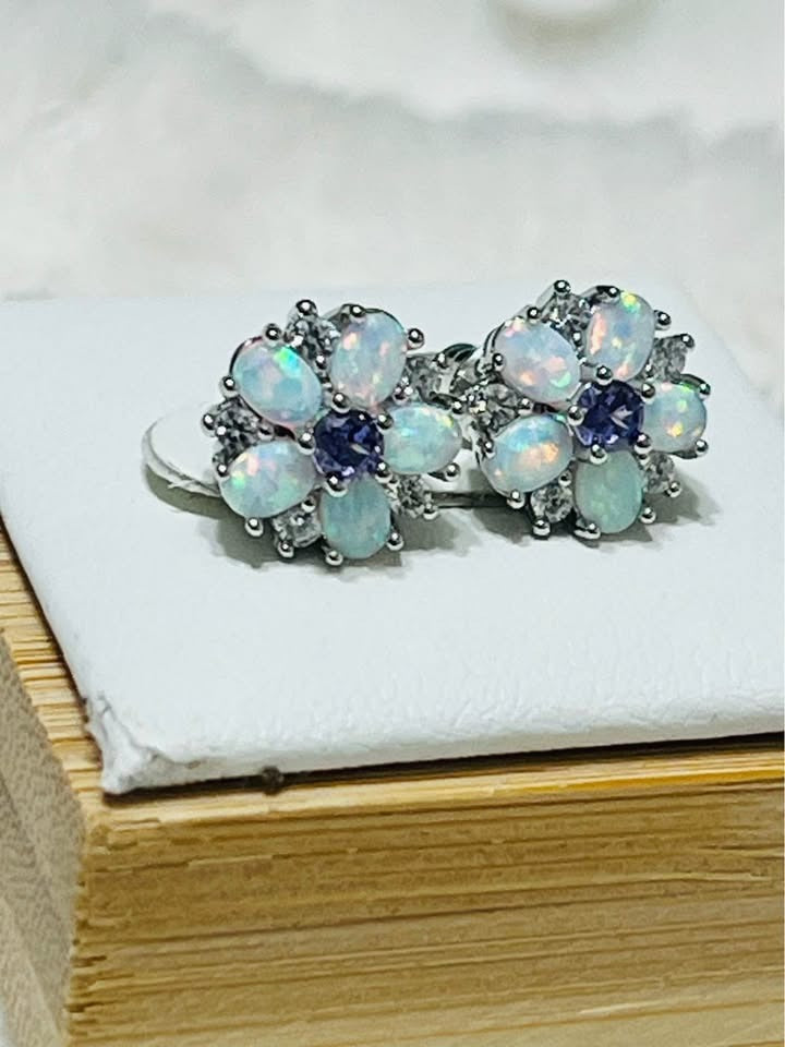 Top-down view of fire opal and amethyst flower stud earrings, perfect for everyday elegance.