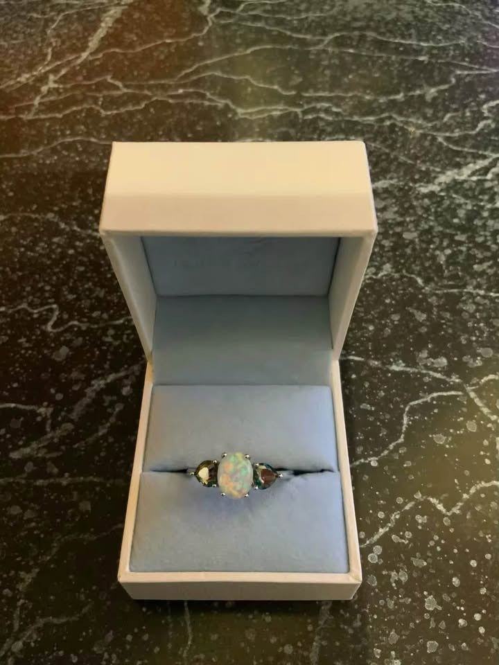 Elegant 14K gold-plated fire opal and mystic topaz ring displayed in an open jewelry gift box.