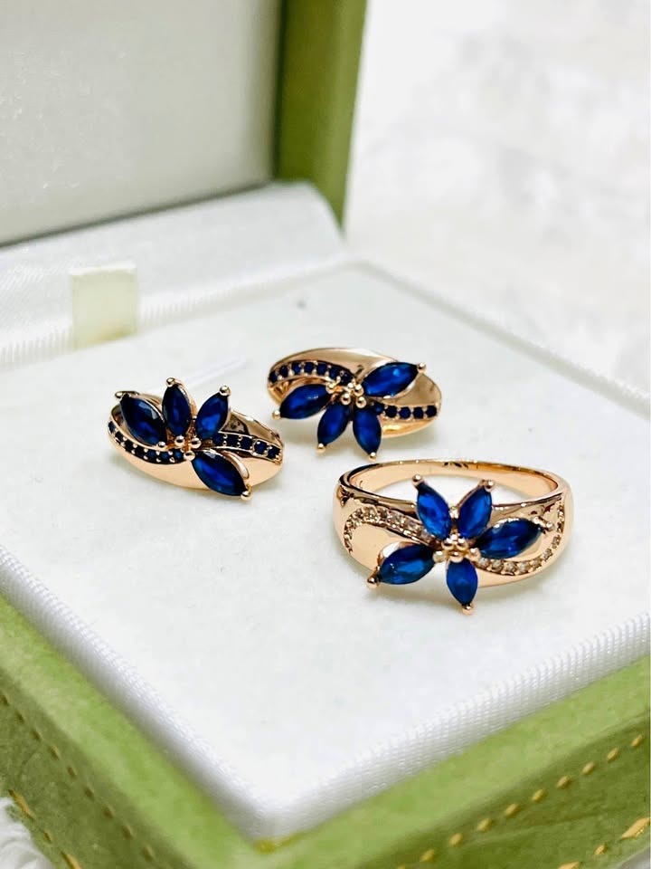 Stunning 14k 585RG rose gold ring and earring set, adorned with dark blue marquise-cut sapphires.