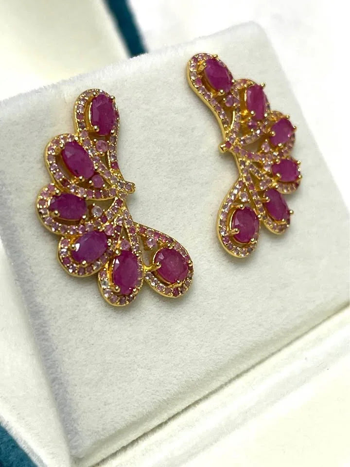  Genuine 925 sterling silver ear climbers with a detailed filigree design. Features natural rubies and pink sapphires.