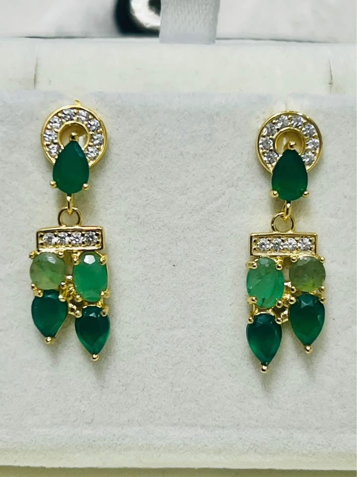  Pair of genuine Colombian emerald drop earrings, featuring varied shades of green and clear accents.