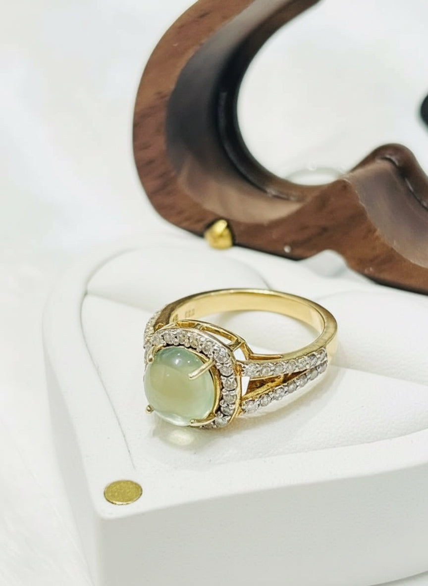 Angled shot of genuine prehnite and diamond ring, 14k gold plated sterling silver, in a heart-shaped box.